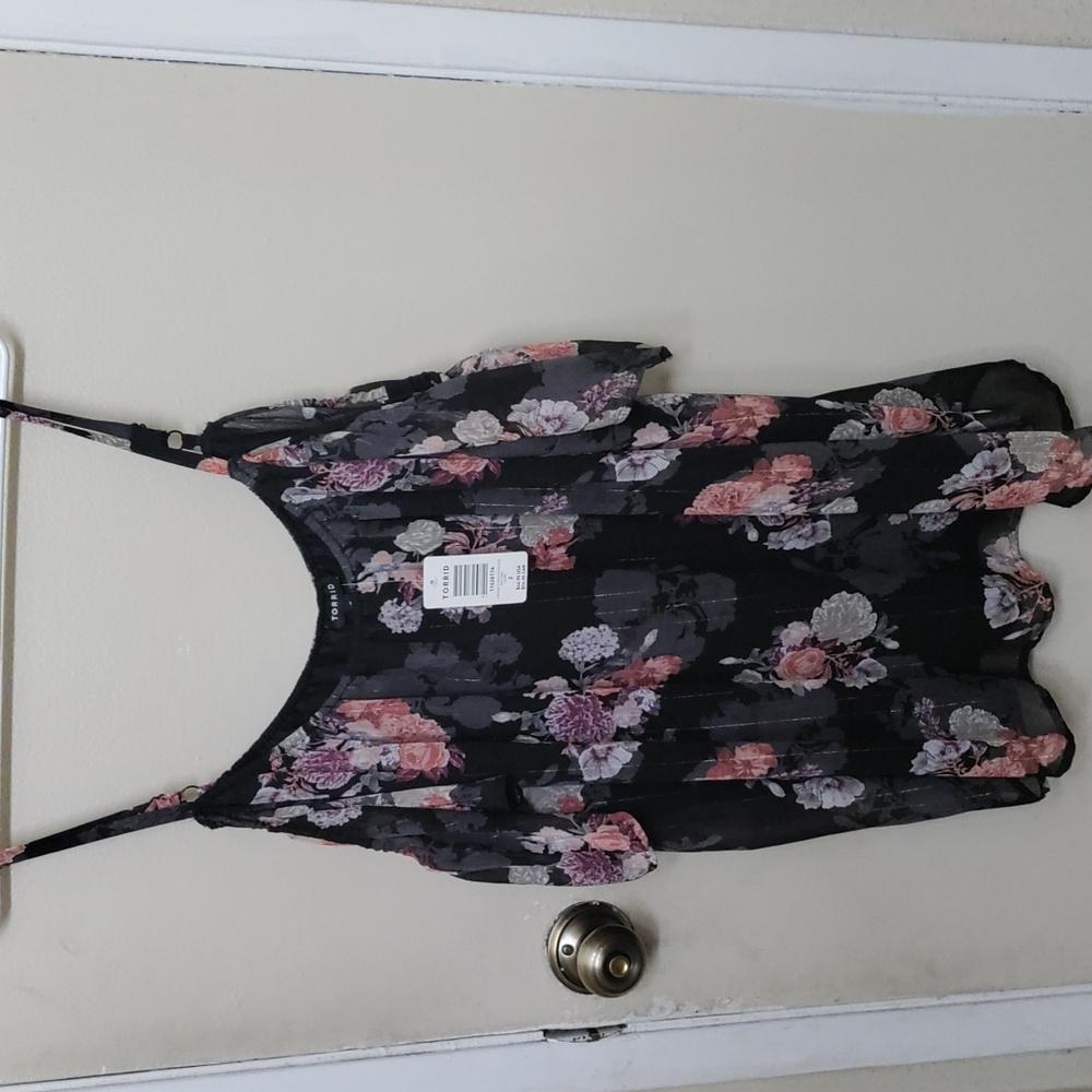 Brand new woman's plus size floral flowy blouse.